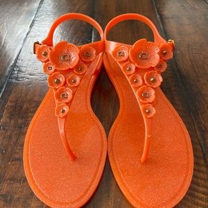 Coach Tea Rose jelly sandals in Mandarin.
